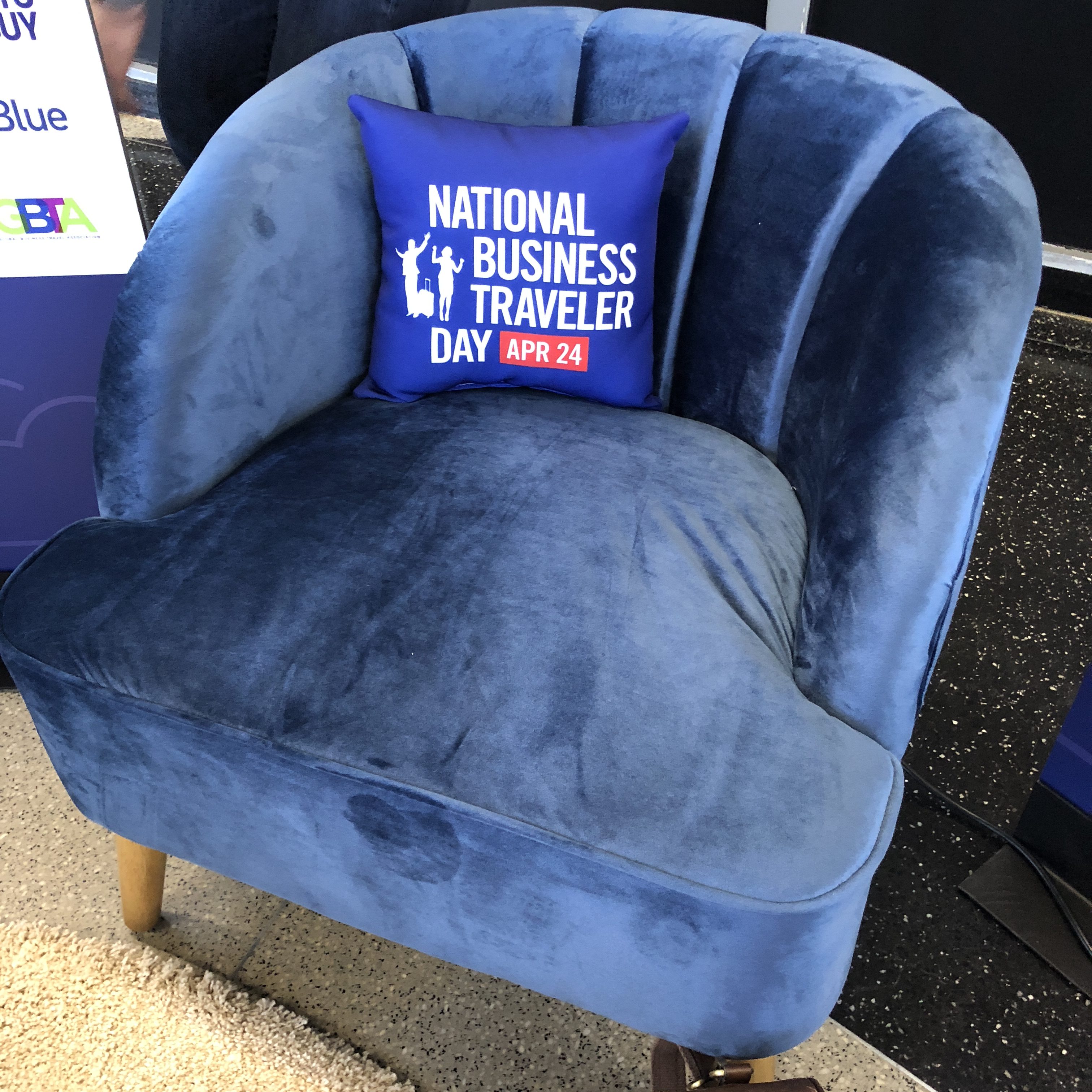 a blue chair with a pillow