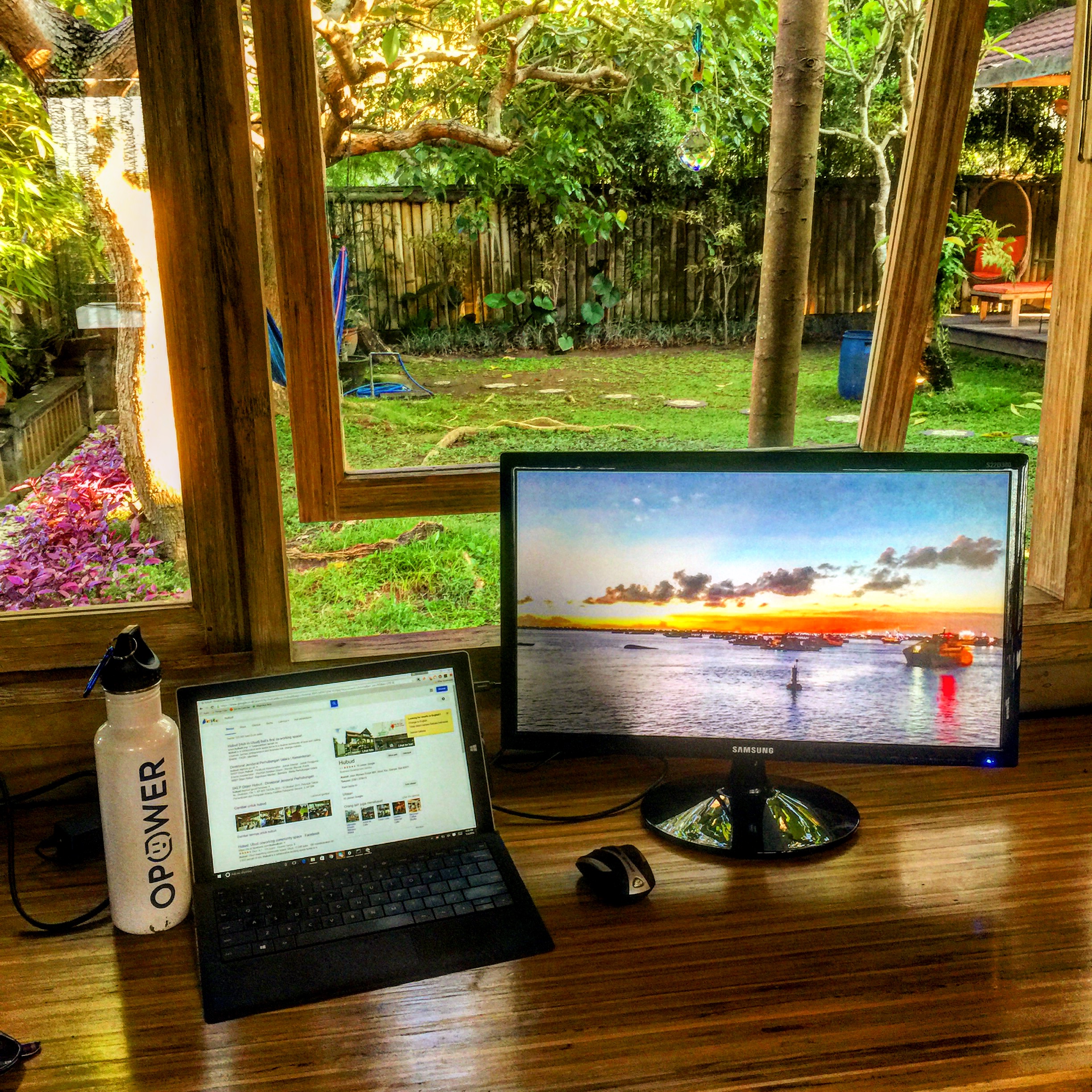 a laptop and monitor on a desk