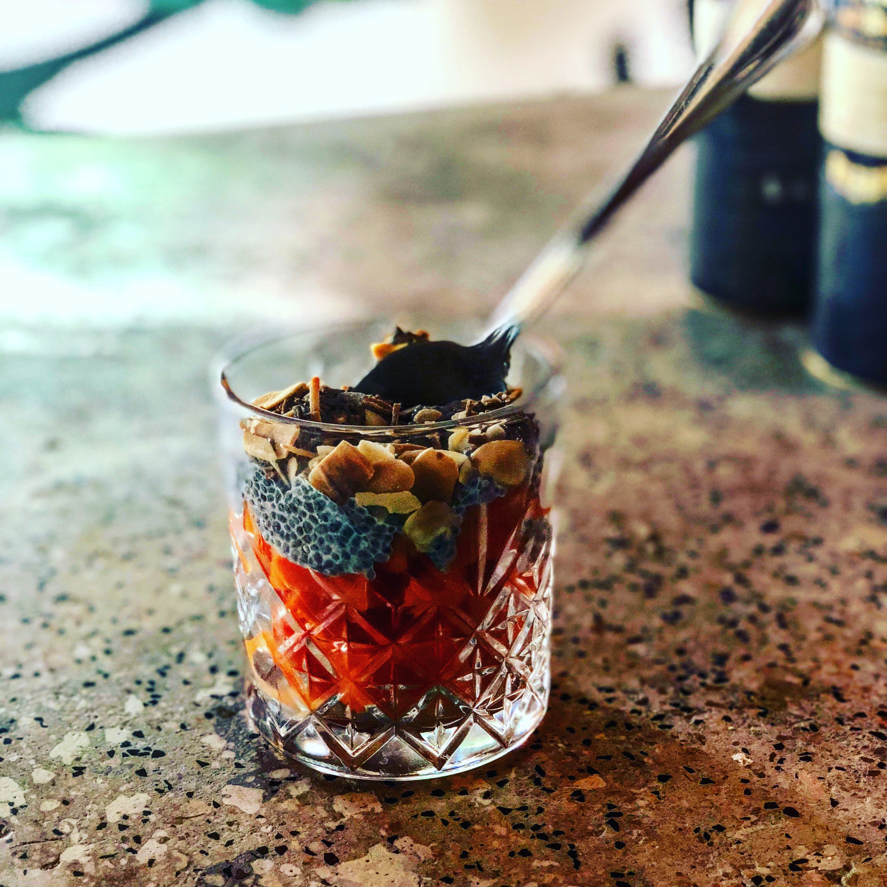 a glass with food in it