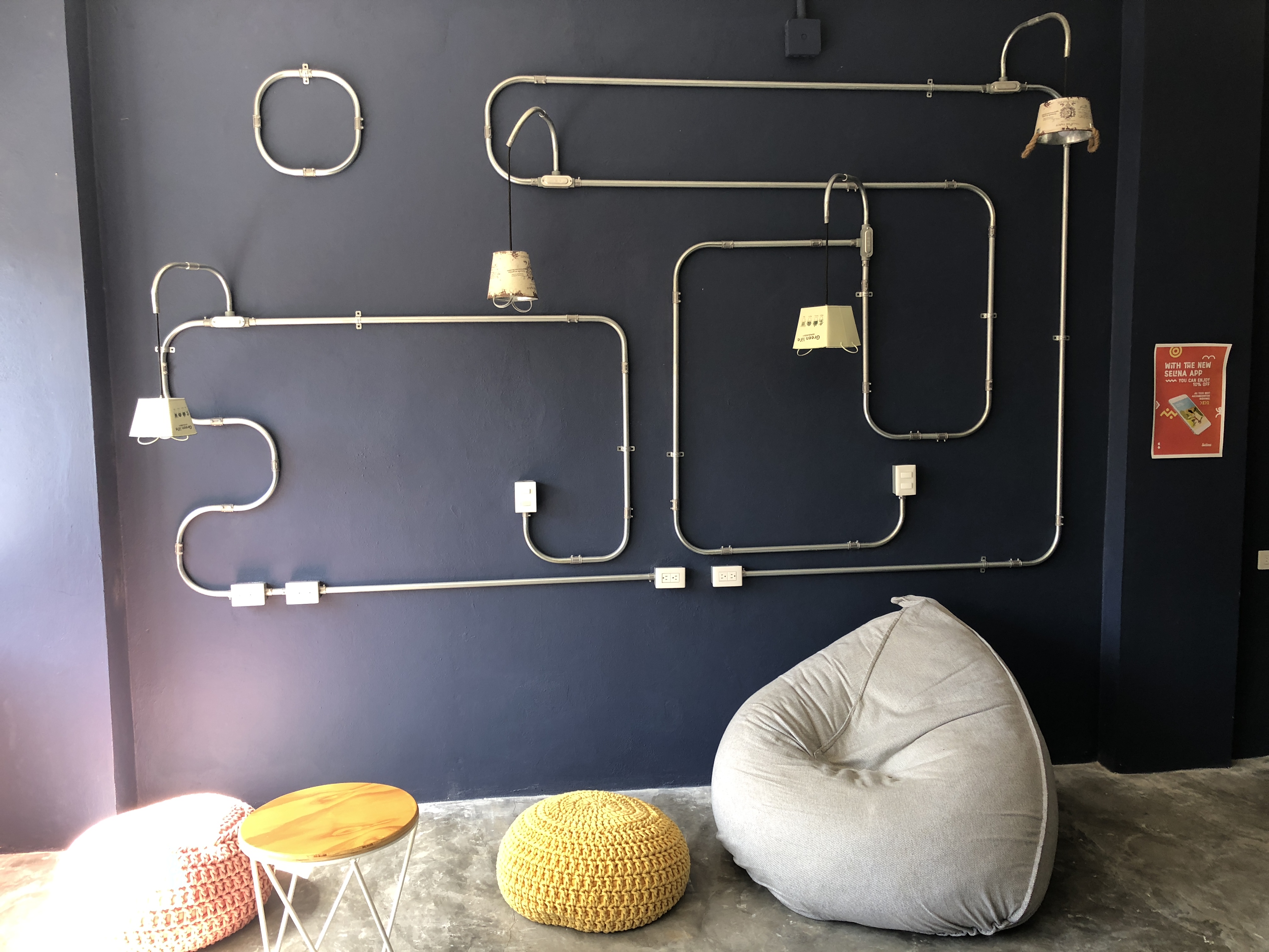 a room with pipes and a bean bag
