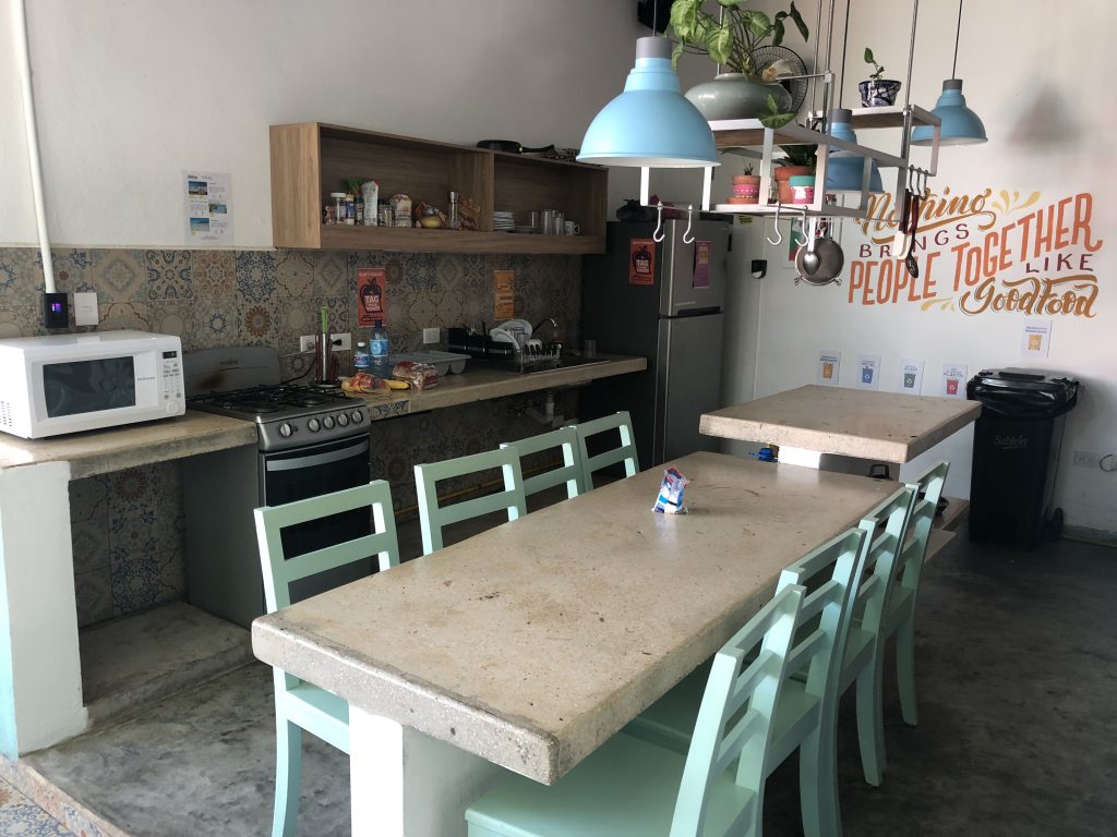 a kitchen with a table and chairs