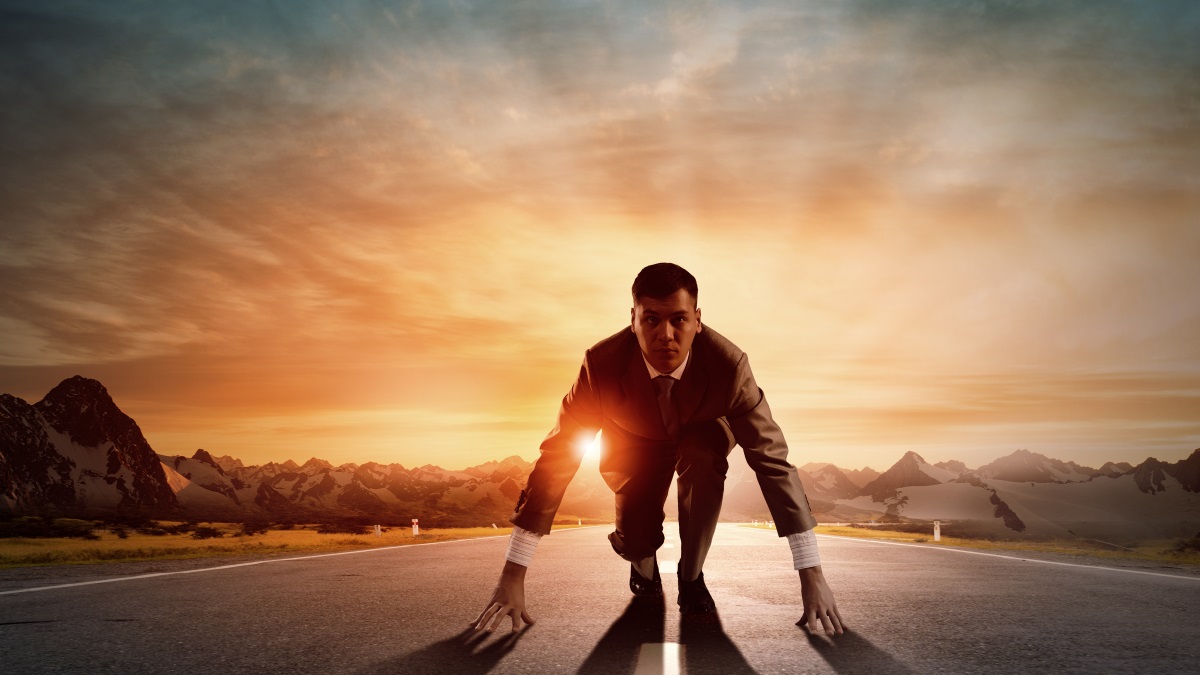 a man in a suit ready to run