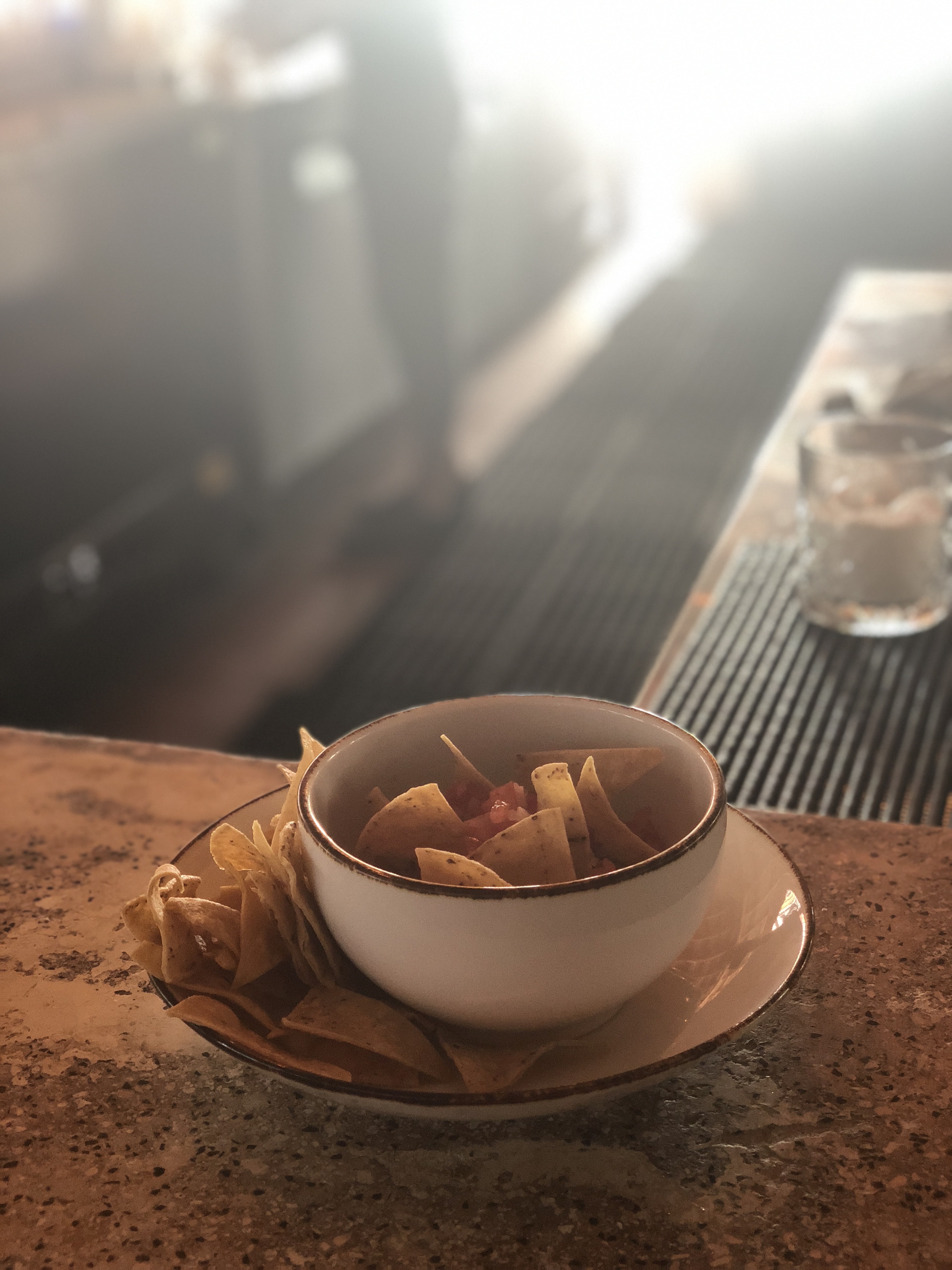 a bowl of chips on a plate