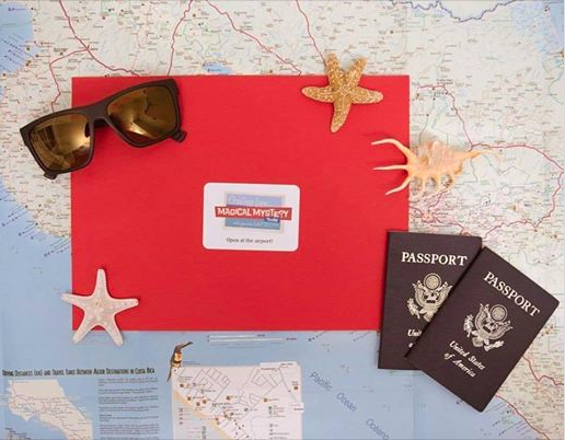 a red envelope with sunglasses and passport on top of a map