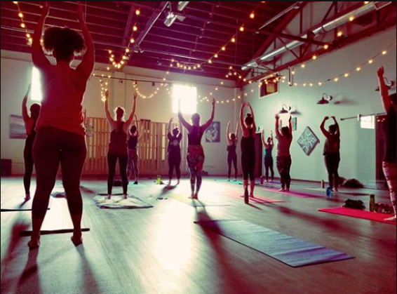 a group of people in a room with lights