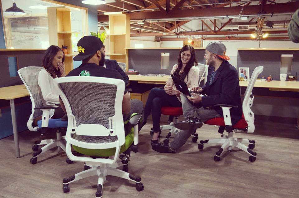 a group of people sitting in chairs