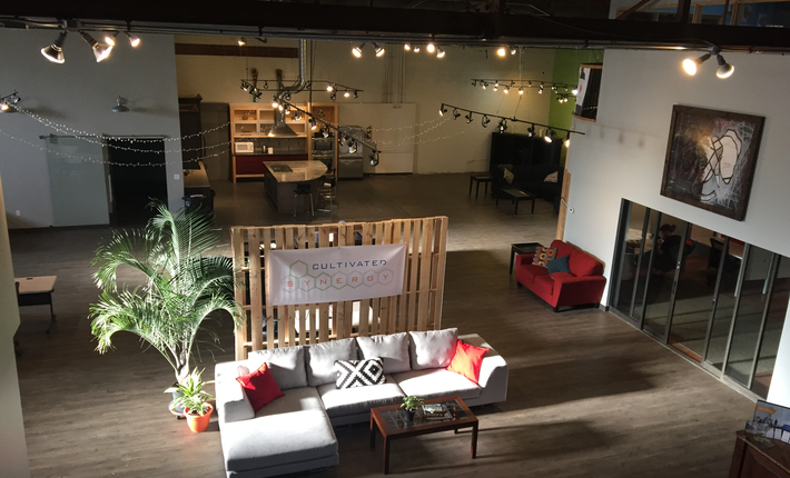 a room with a wood floor and a wood pallet wall