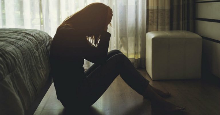 a woman sitting on the floor