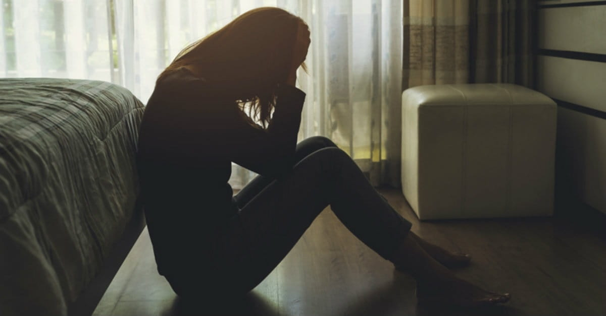 a woman sitting on the floor