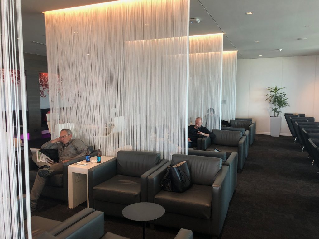 a group of people sitting in a lounge area