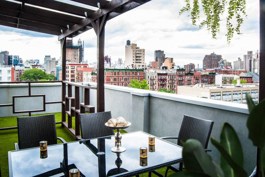 a table and chairs on a rooftop