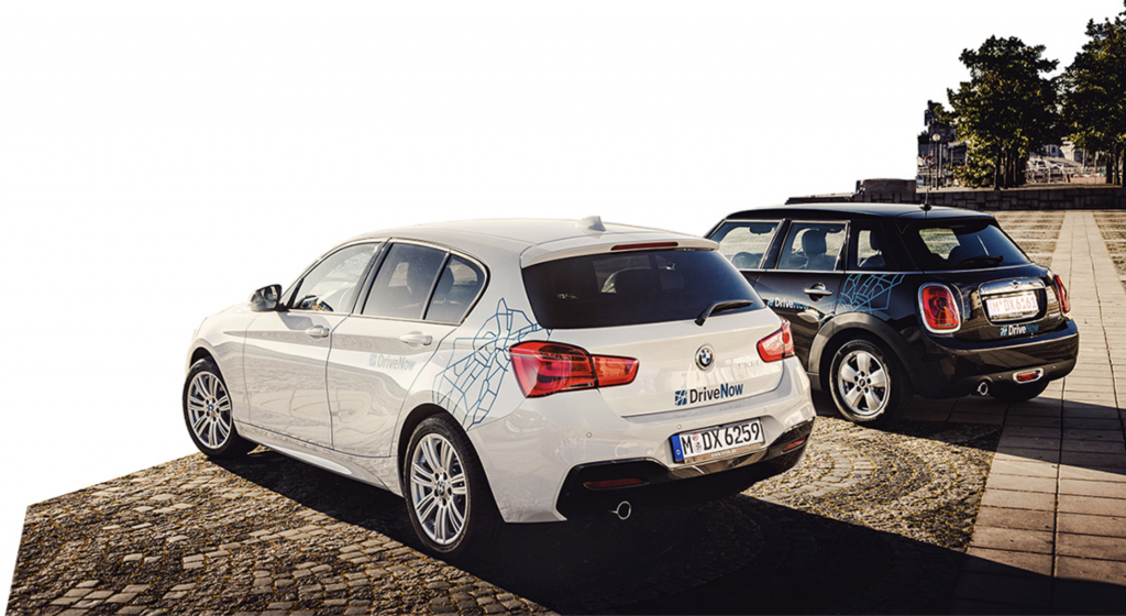 a group of cars parked on a brick surface