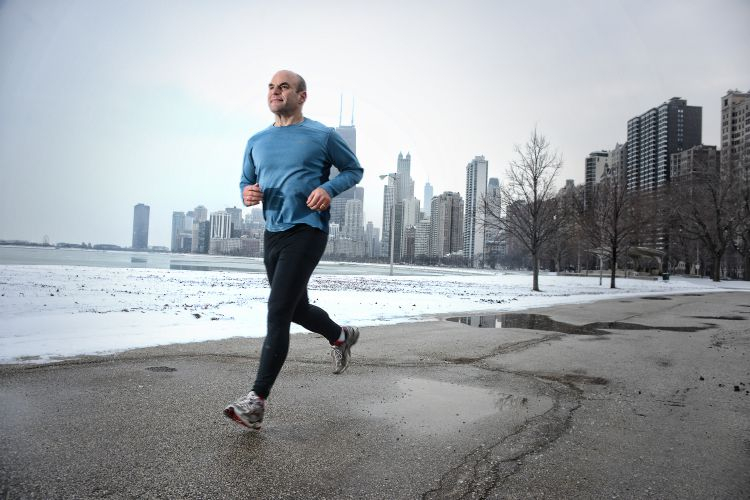 a man running on a sidewalk