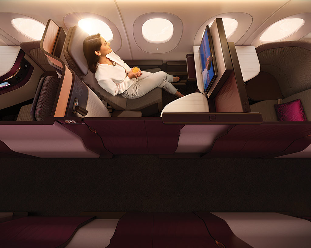 a woman sitting in a chair in a plane