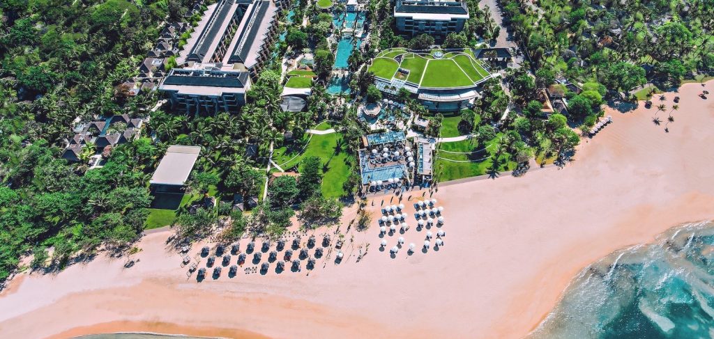 an aerial view of a beach and a resort