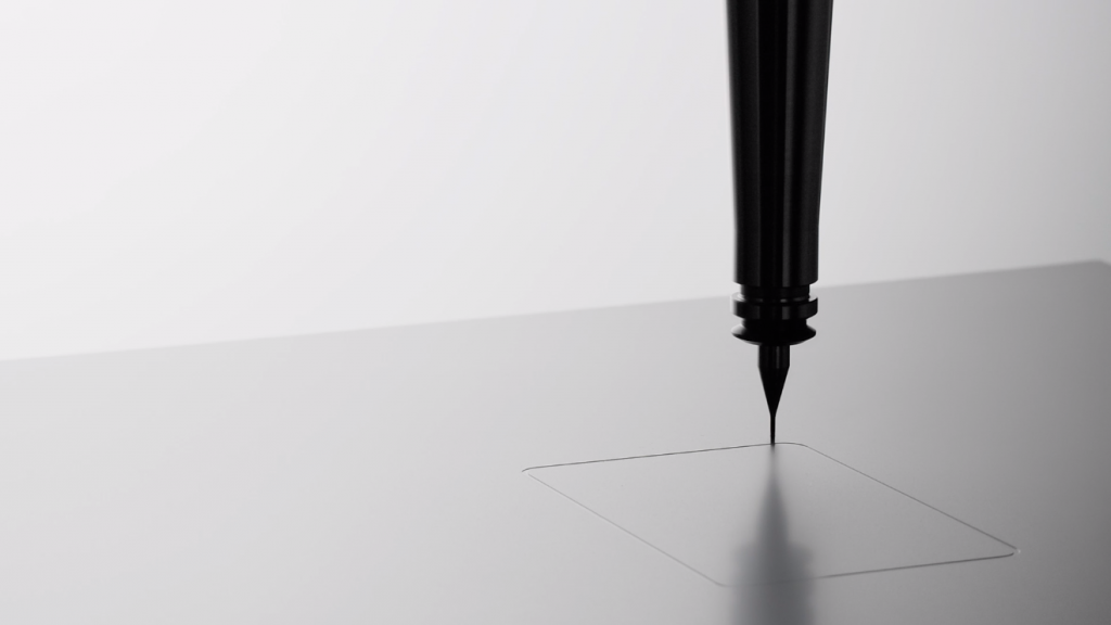 a black pen on a surface