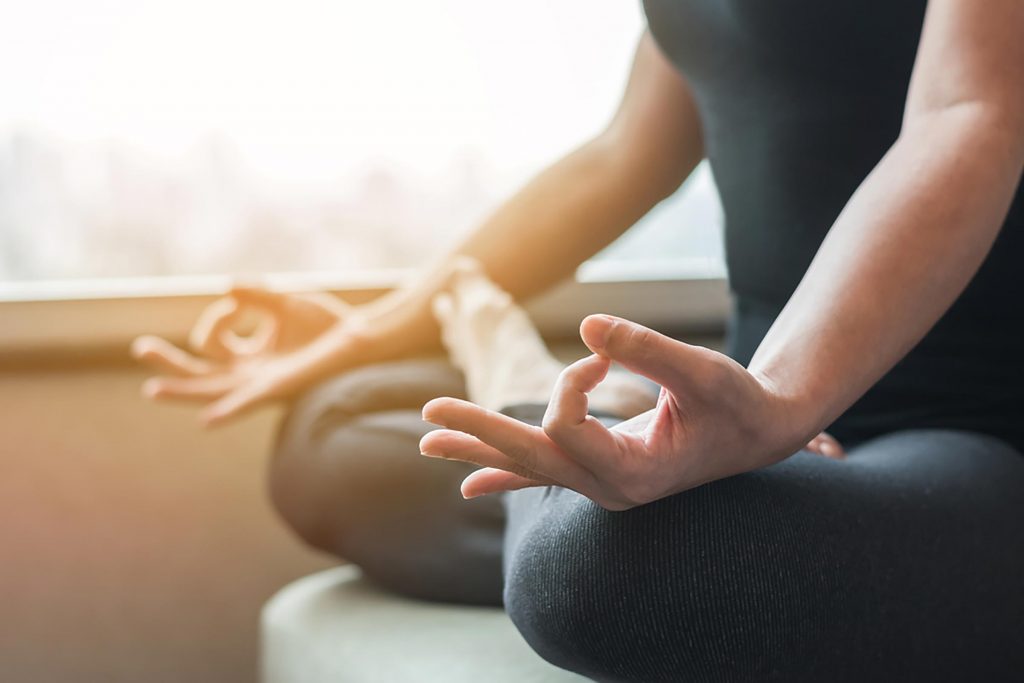 a person meditating in a yoga pose