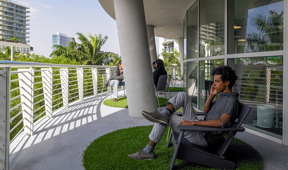 a man sitting in a chair on a lawn