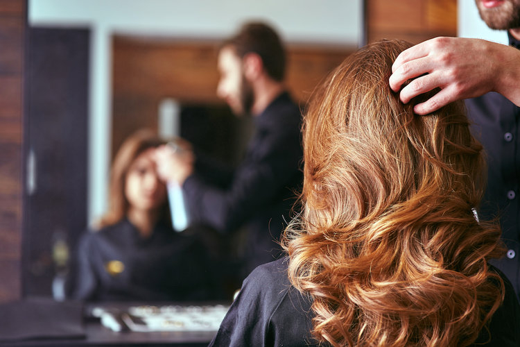 a woman with her hair pulled back