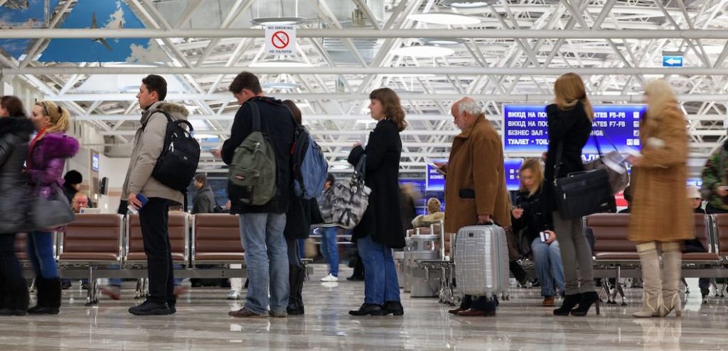 a group of people waiting in a terminal