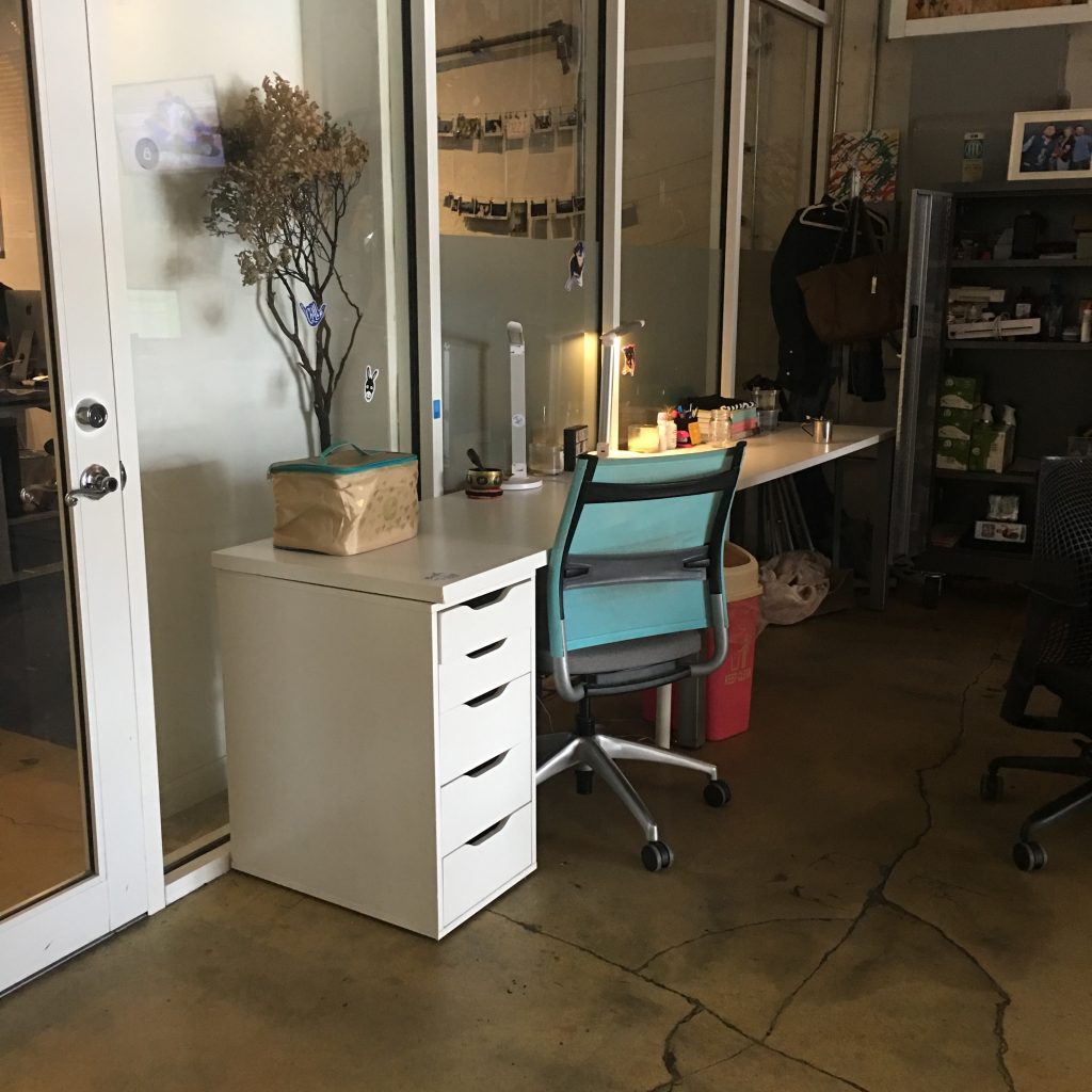 a desk and chair in a room