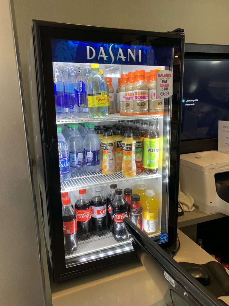 a refrigerator with drinks and beverages