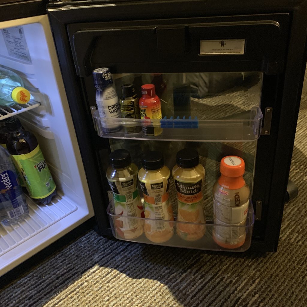 a mini fridge with drinks inside