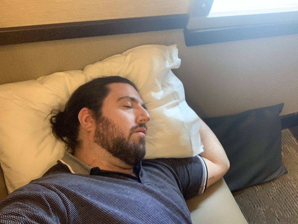 a man sleeping on a pillow