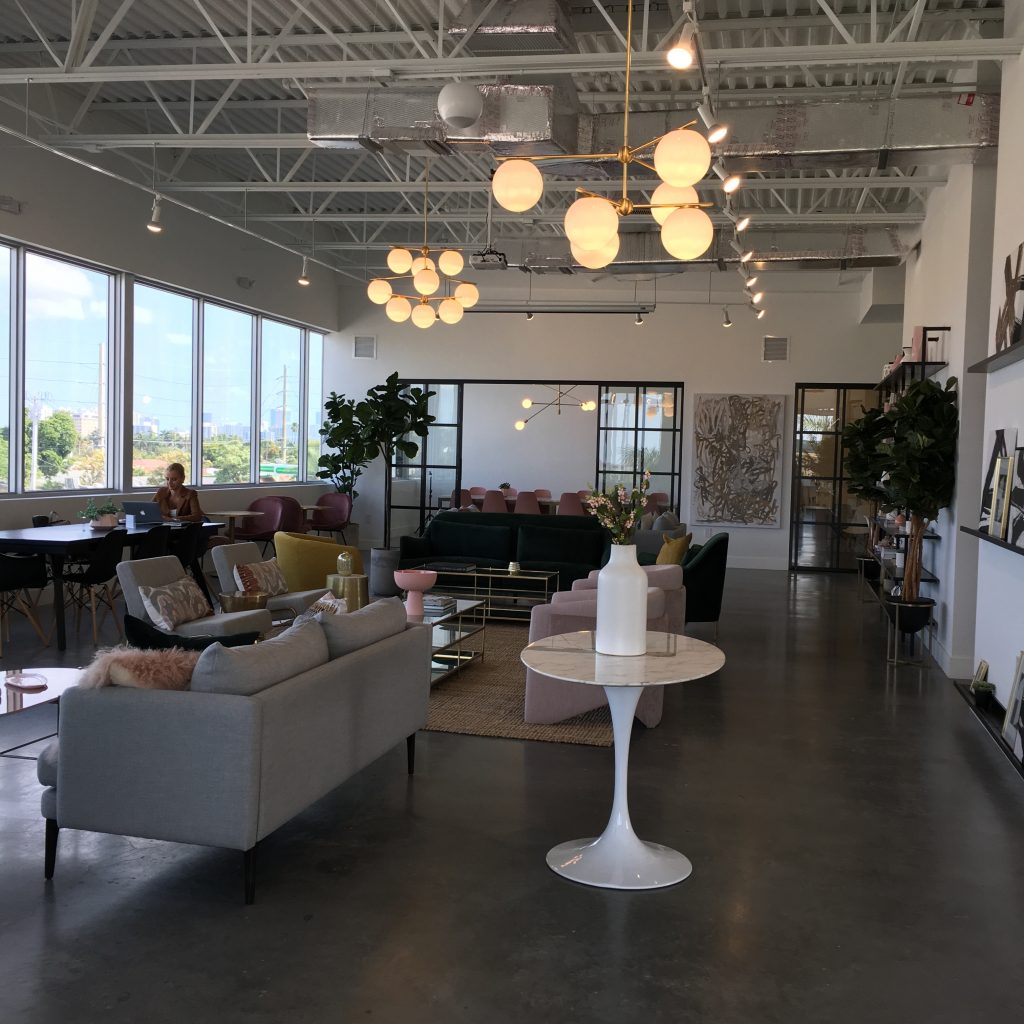 a room with a large ceiling and a large window
