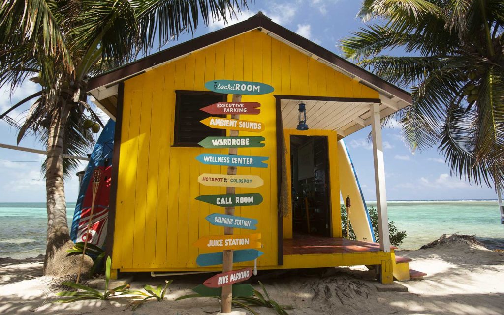 a yellow house with signs on it