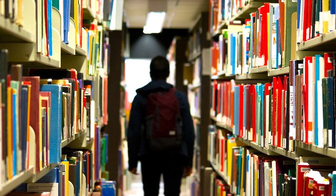 a person walking in a library