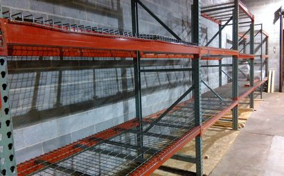 a warehouse shelving unit with metal bars