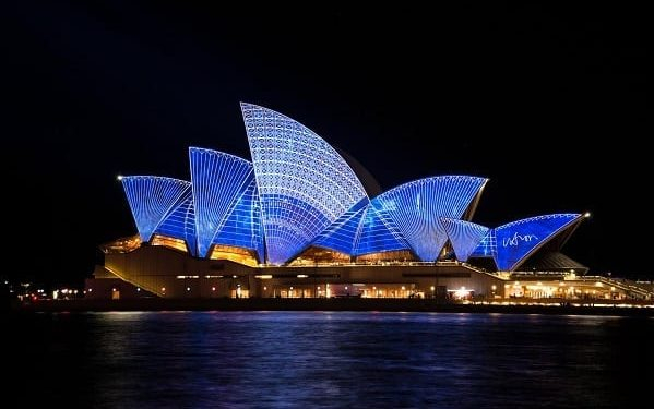 Sydney Opera House with blue lights at night