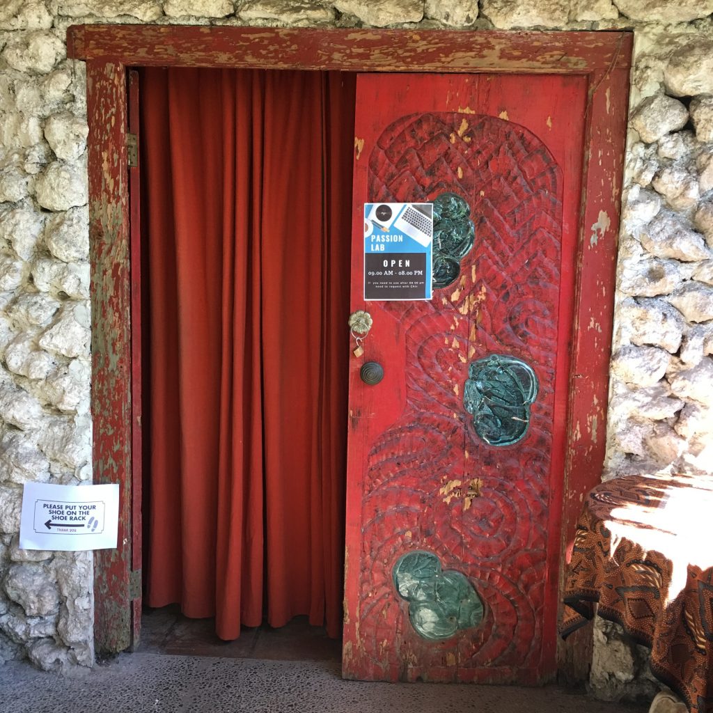 a red door with a red curtain