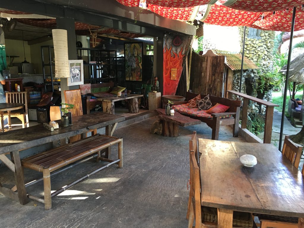 a patio with tables and chairs