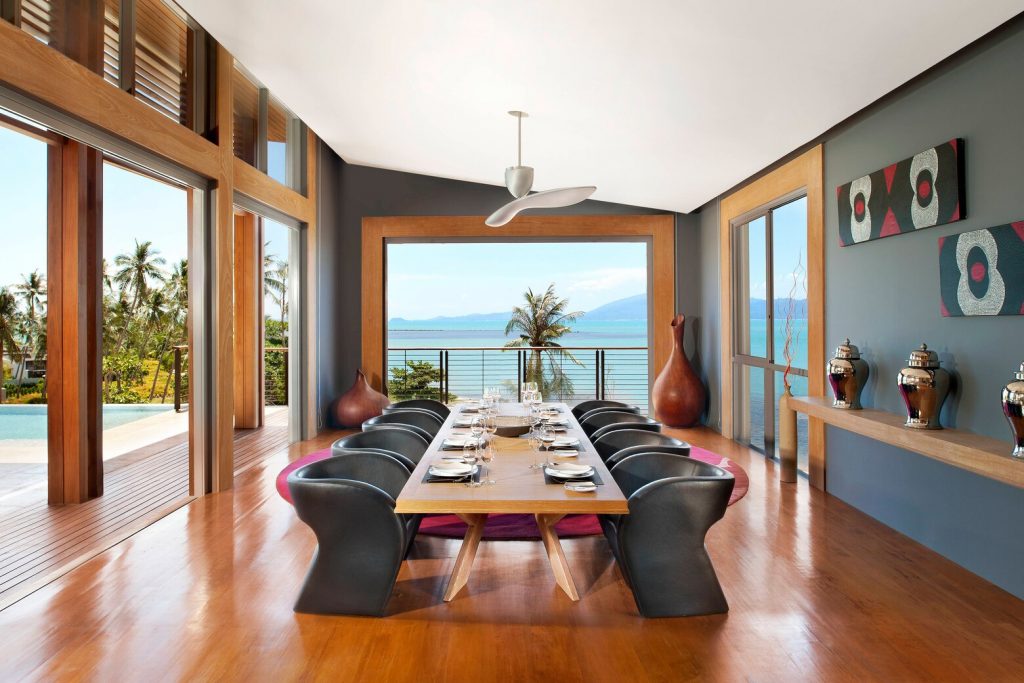 a dining room with a table and chairs