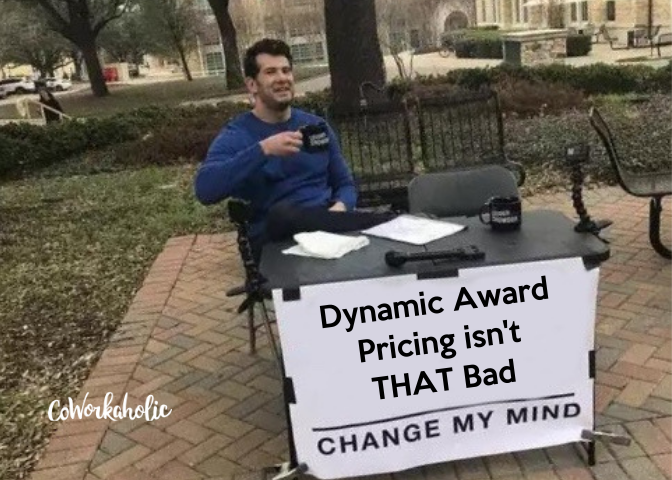 a man sitting at a table with a sign