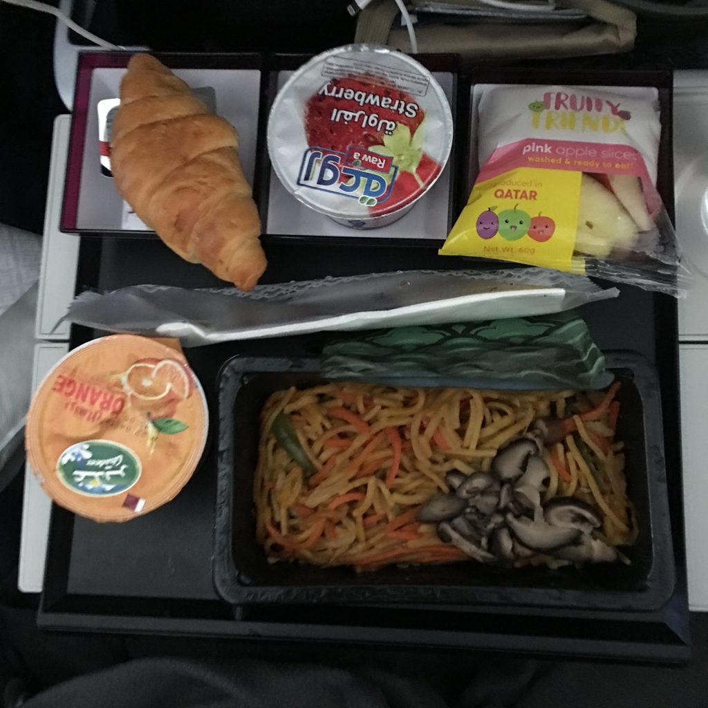 food on a tray on a plane