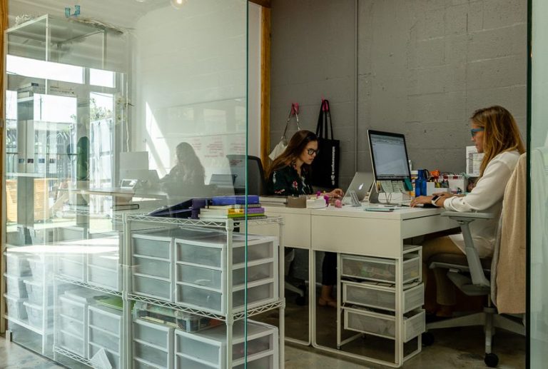 a group of people sitting at a desk