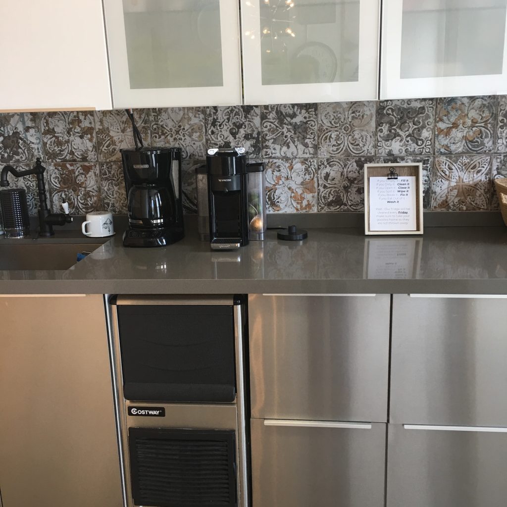 a kitchen with a counter top and a coffee maker