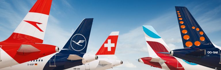 a group of airplanes with a white cross on the tail