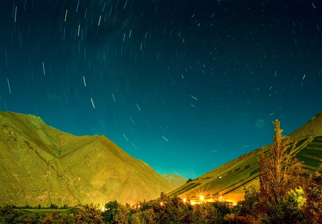a mountain range with a starry sky