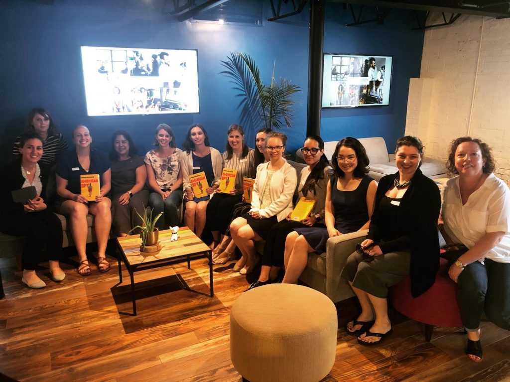 a group of women sitting on couches