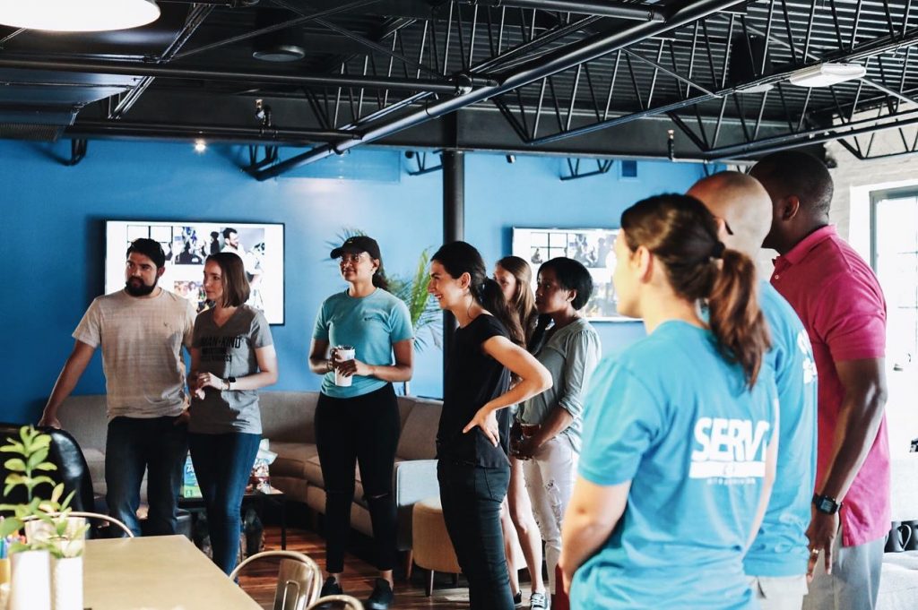 a group of people standing in a room