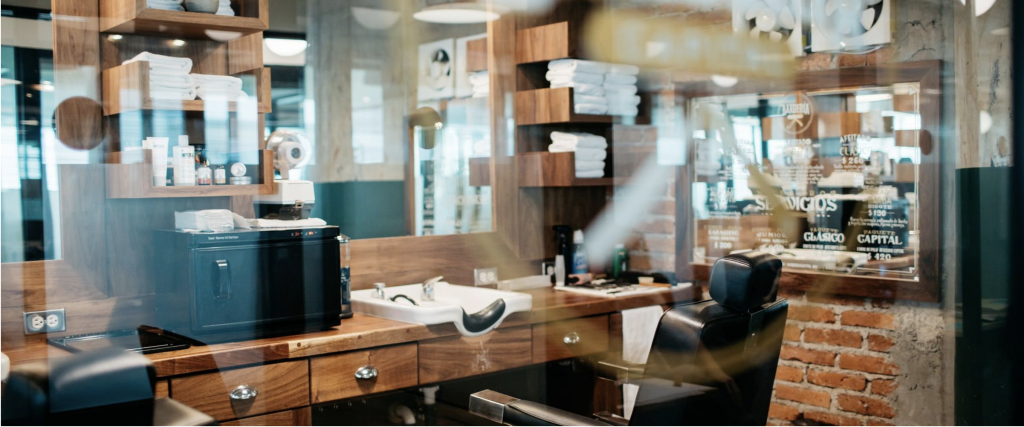 a barber shop with a mirror