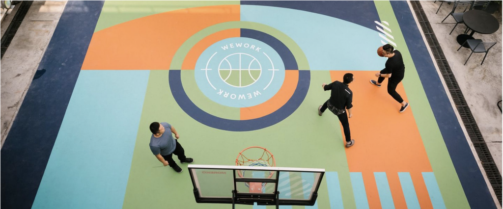 a couple of men playing basketball