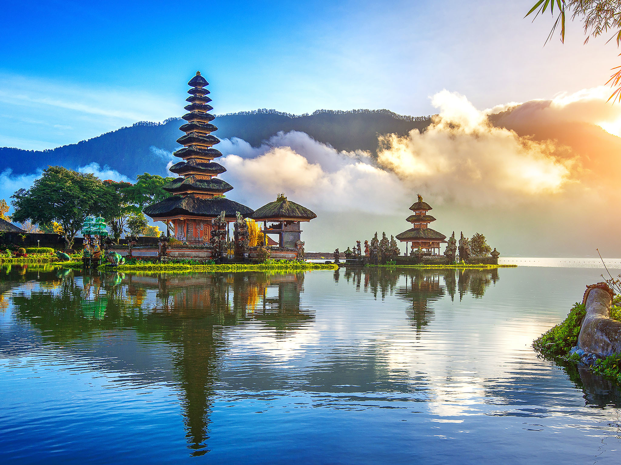 a lake with a pagoda and trees