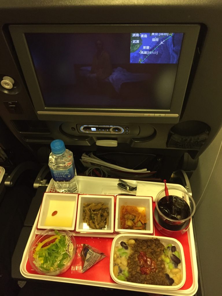 a tray of food on a tray in an airplane