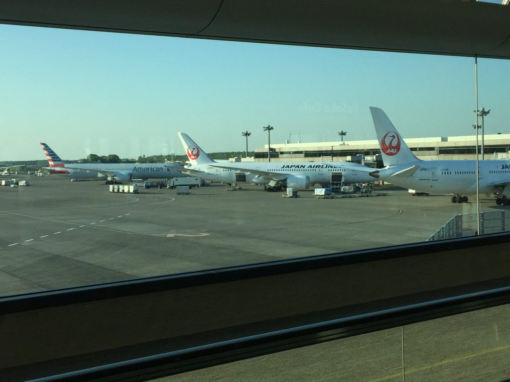 a group of airplanes parked on a tarmac