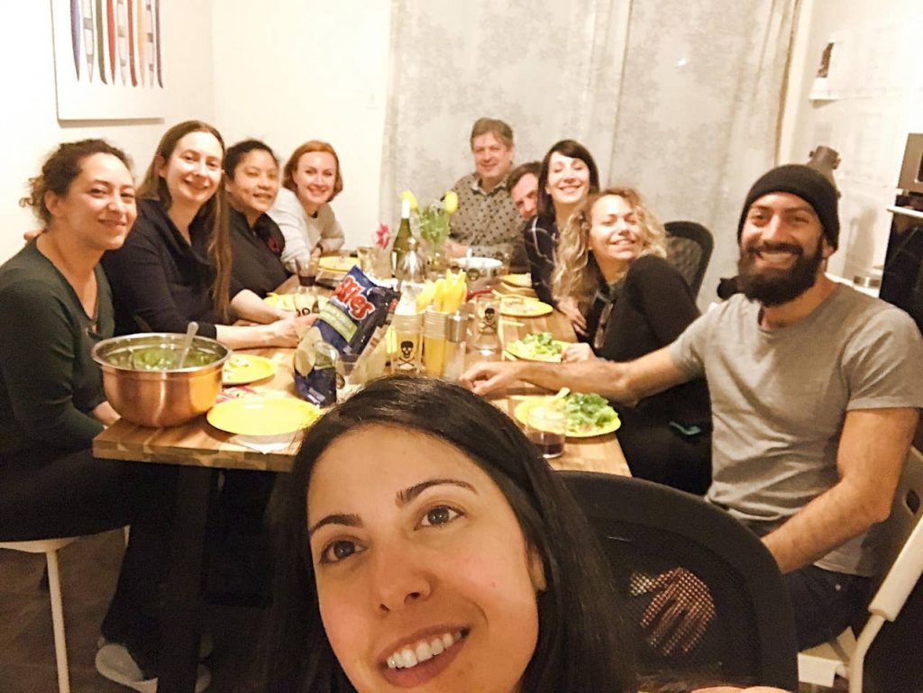 a group of people sitting around a table